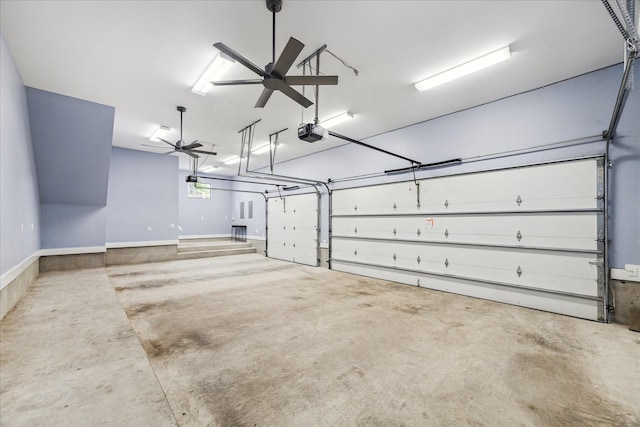 garage with baseboards, a ceiling fan, and a garage door opener