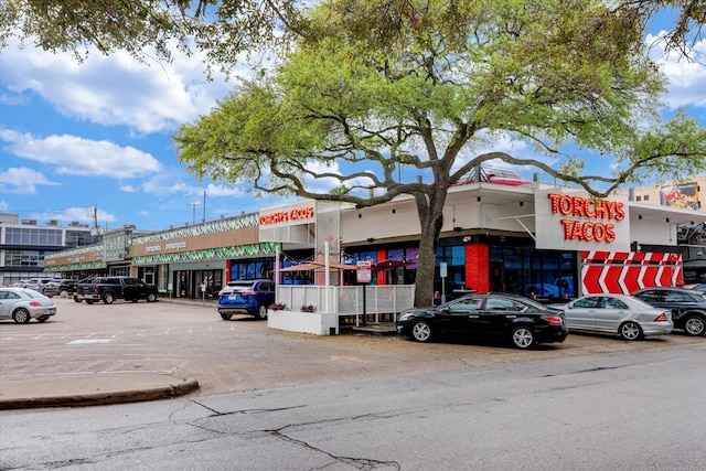 view of property with uncovered parking