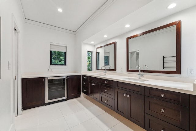 full bathroom with ornamental molding, wine cooler, a sink, and recessed lighting