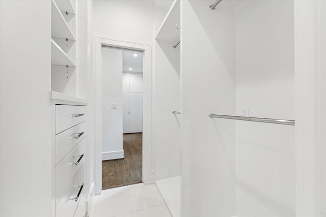 walk in closet featuring light tile patterned floors