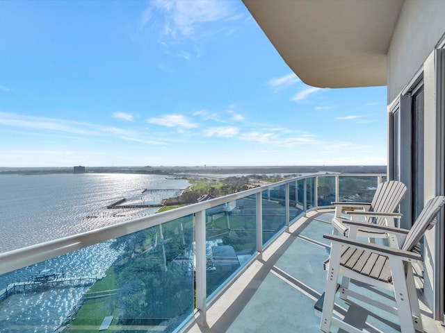 balcony featuring a water view