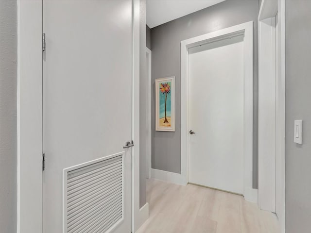 hallway featuring light wood-style flooring