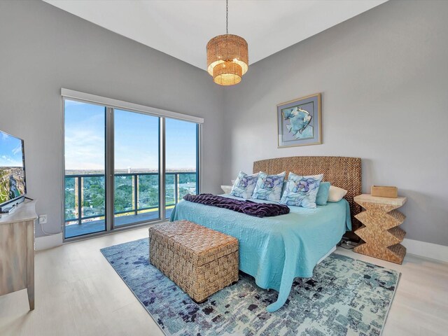 bedroom featuring wood finished floors and baseboards