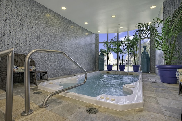 view of pool featuring an indoor hot tub