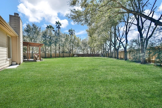 view of yard featuring a fenced backyard