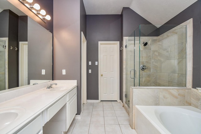 full bath with a garden tub, double vanity, a stall shower, a sink, and tile patterned flooring