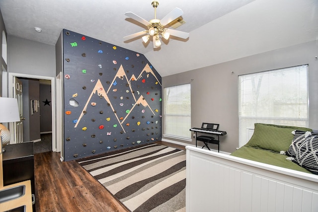 bedroom featuring lofted ceiling, ceiling fan, and wood finished floors