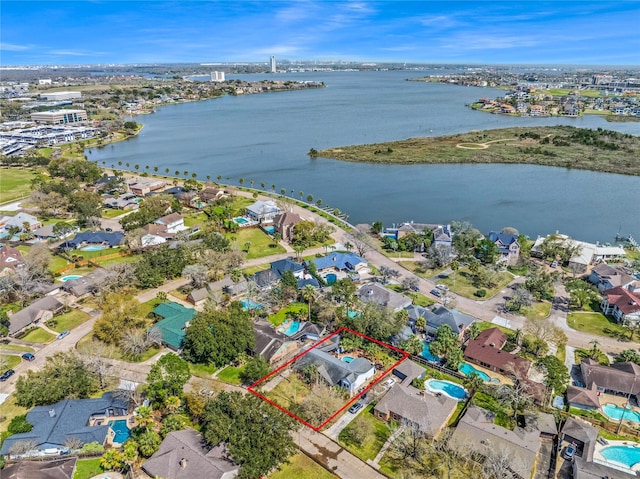 aerial view featuring a residential view and a water view