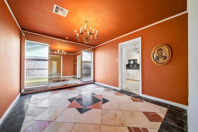 interior space featuring a chandelier, visible vents, baseboards, and ornamental molding