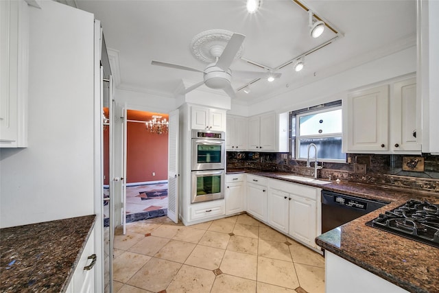 kitchen featuring tasteful backsplash, stainless steel double oven, white cabinets, and a sink