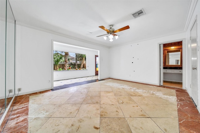 tiled spare room with visible vents, a ceiling fan, crown molding, and baseboards