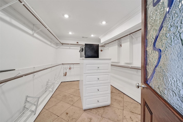 spacious closet with light tile patterned floors