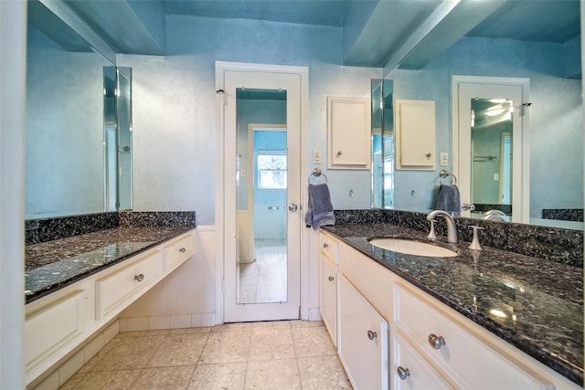 bathroom featuring vanity and tile patterned flooring