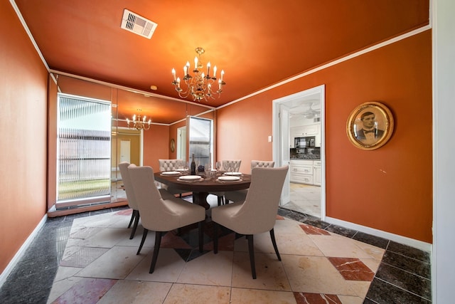 dining room with visible vents, baseboards, an inviting chandelier, and ornamental molding