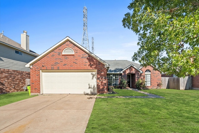 ranch-style house featuring a garage, driveway, brick siding, and a front yard