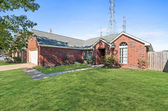 ranch-style home featuring an attached garage, a front yard, fence, and brick siding