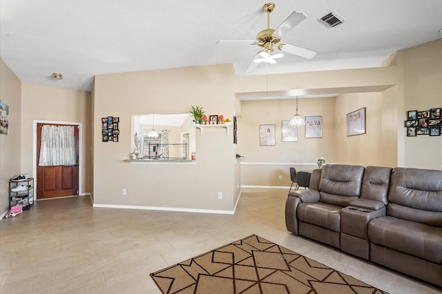 living room featuring baseboards, visible vents, and a ceiling fan