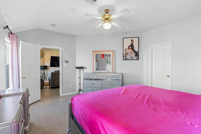 bedroom featuring a ceiling fan, baseboards, vaulted ceiling, and visible vents