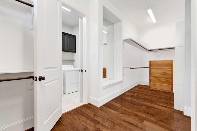 spacious closet with wood finished floors and washing machine and clothes dryer