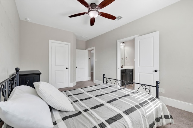 bedroom with baseboards, visible vents, a ceiling fan, connected bathroom, and light colored carpet