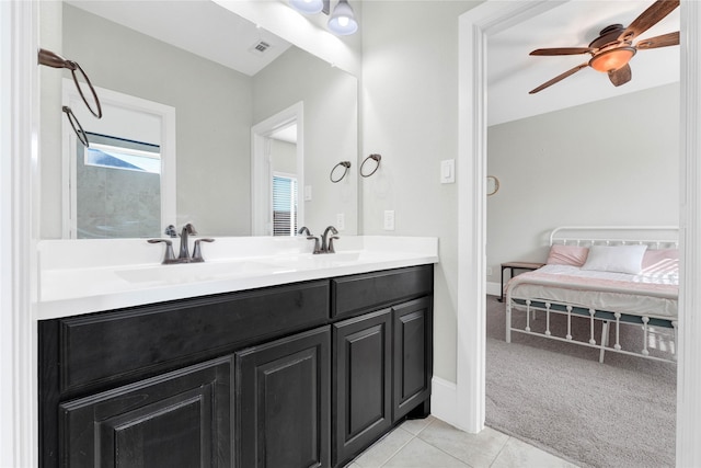 full bathroom featuring double vanity, tile patterned flooring, visible vents, and a sink