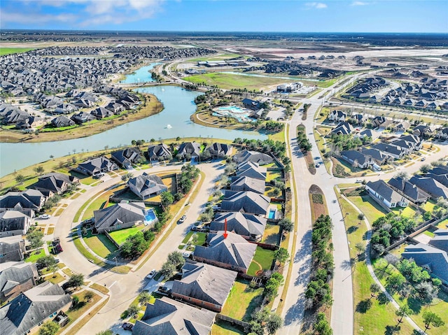 aerial view with a residential view and a water view