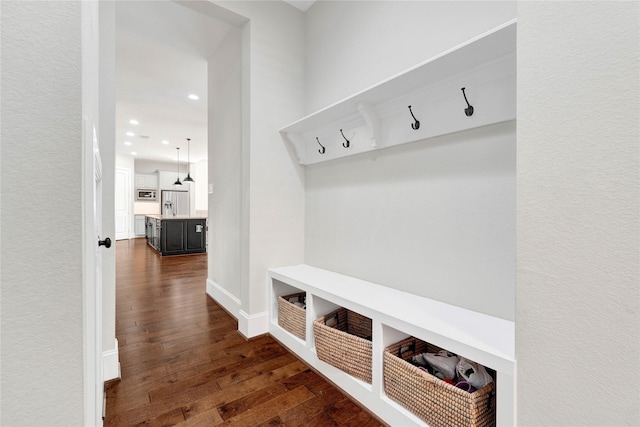 mudroom featuring dark wood-style floors, recessed lighting, and baseboards