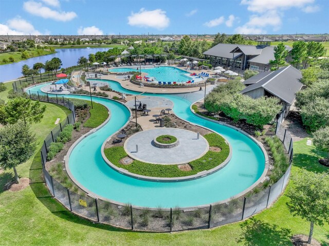 birds eye view of property with a water view