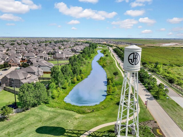 drone / aerial view featuring a water view and a residential view