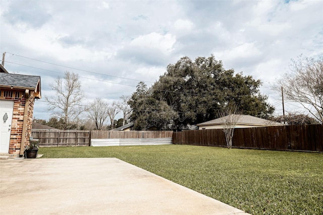 view of yard featuring a fenced backyard and a patio