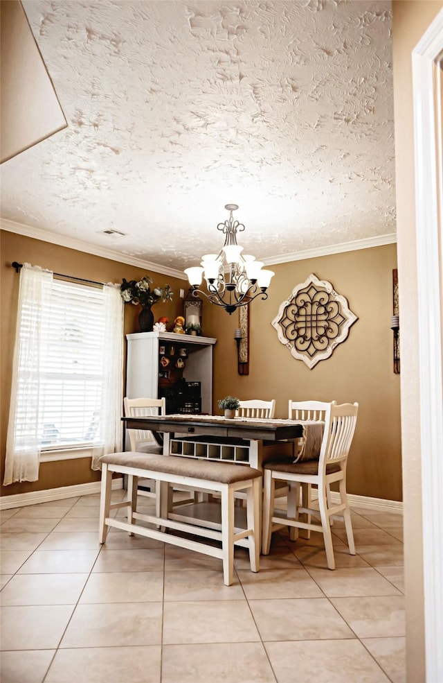 dining space featuring a notable chandelier, light tile patterned flooring, and crown molding