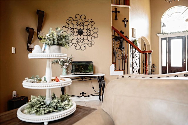 tiled foyer featuring stairway