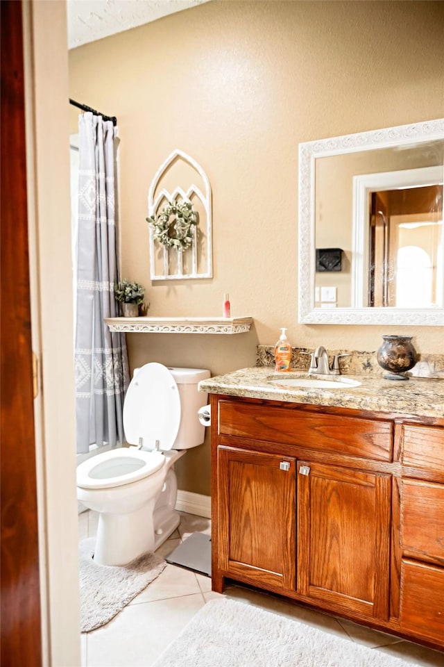 full bath with vanity, curtained shower, tile patterned flooring, and toilet