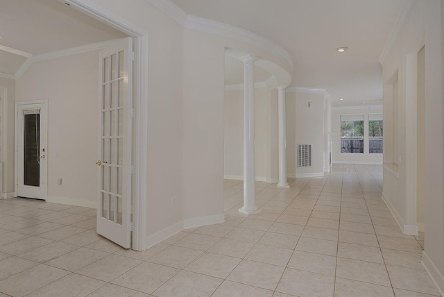 hallway featuring ornamental molding, decorative columns, and light tile patterned floors