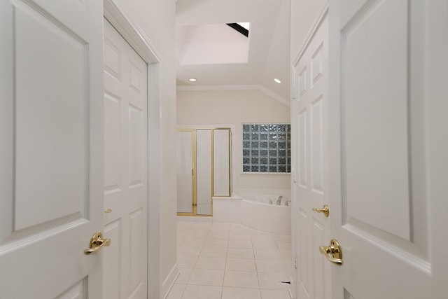 corridor featuring lofted ceiling, light tile patterned floors, and recessed lighting