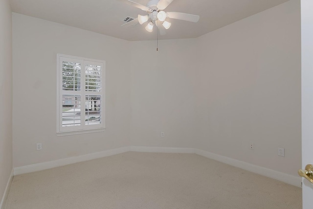 unfurnished room with a ceiling fan, baseboards, visible vents, and carpet flooring