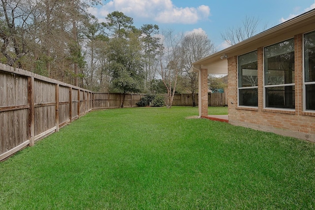 view of yard featuring a fenced backyard