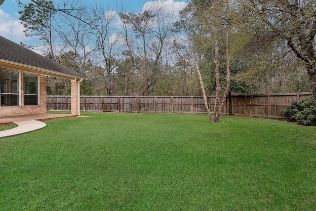 view of yard with a fenced backyard