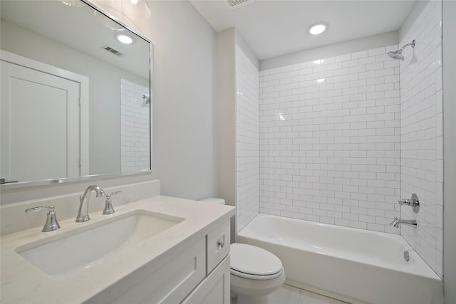 bathroom featuring toilet, washtub / shower combination, vanity, and visible vents