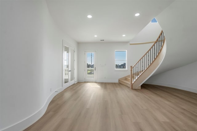 entrance foyer featuring light wood-style flooring, recessed lighting, visible vents, baseboards, and stairs