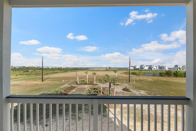 view of yard with a balcony