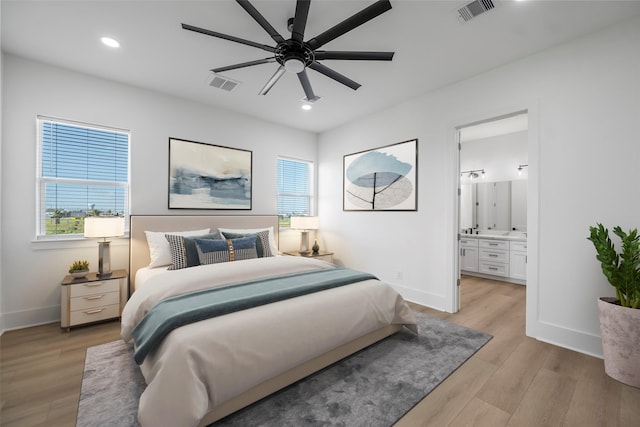 bedroom with light wood-type flooring, visible vents, and recessed lighting