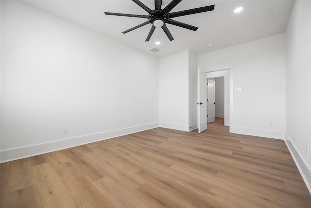 unfurnished room featuring ceiling fan, light wood finished floors, recessed lighting, and baseboards