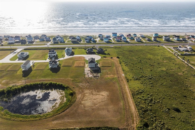 drone / aerial view featuring a water view and a residential view