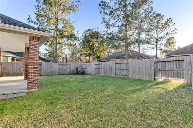 view of yard with a fenced backyard