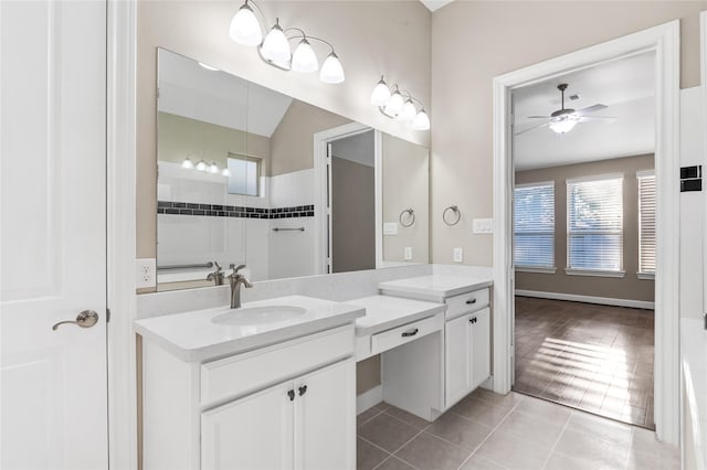 full bathroom with a ceiling fan, vanity, and tile patterned floors