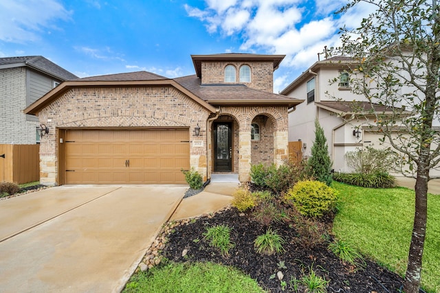 view of front of property with a garage, driveway, roof with shingles, fence, and brick siding