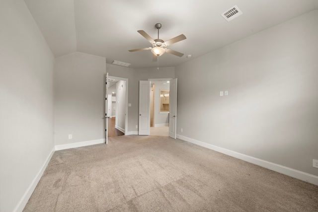 unfurnished bedroom featuring baseboards, visible vents, a ceiling fan, and light colored carpet