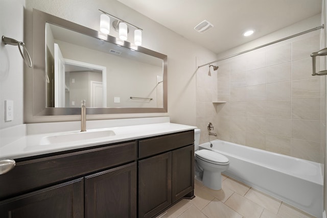 full bath featuring shower / bath combination, visible vents, toilet, vanity, and tile patterned flooring