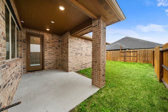 view of yard with a patio area and a fenced backyard